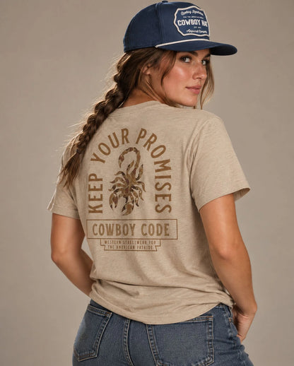 Female model in Cowboy Code No. 6 Keep Your Promises tee, Tan and Navy rope hat, Cowboy Revolution