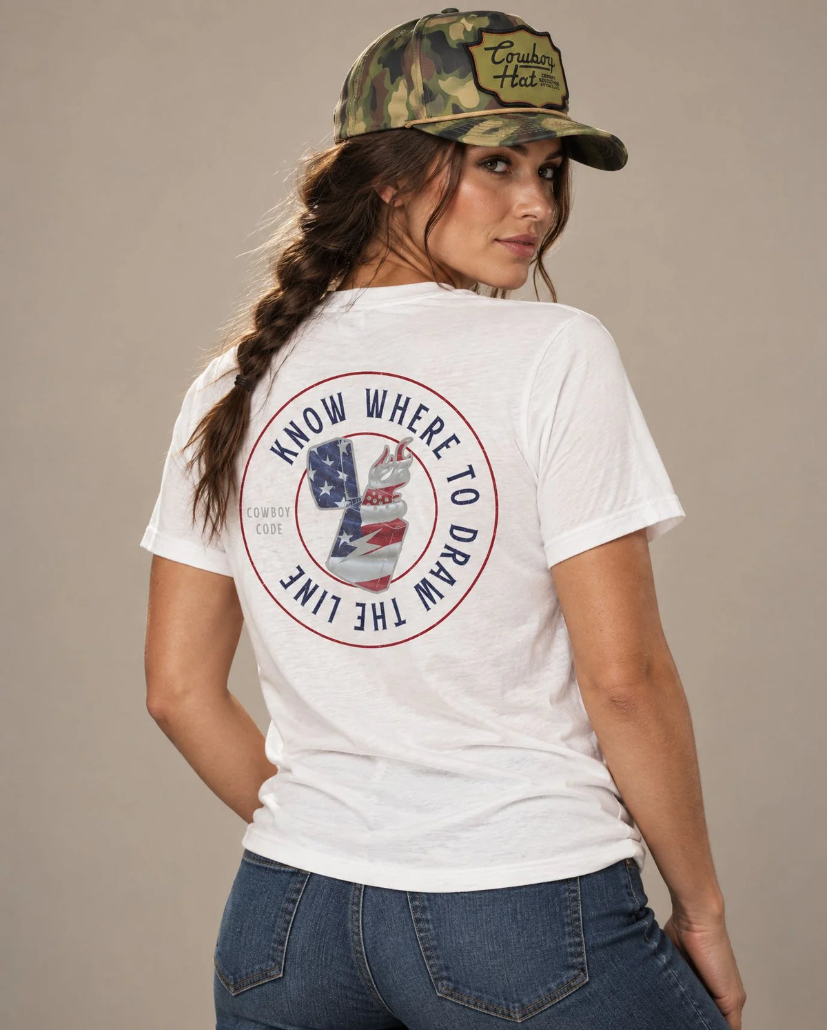 Female model in Cowboy Code No. 10 Know Where to Draw the Line tee, Solid White and Woodland Camo rope hat, Cowboy Revolution