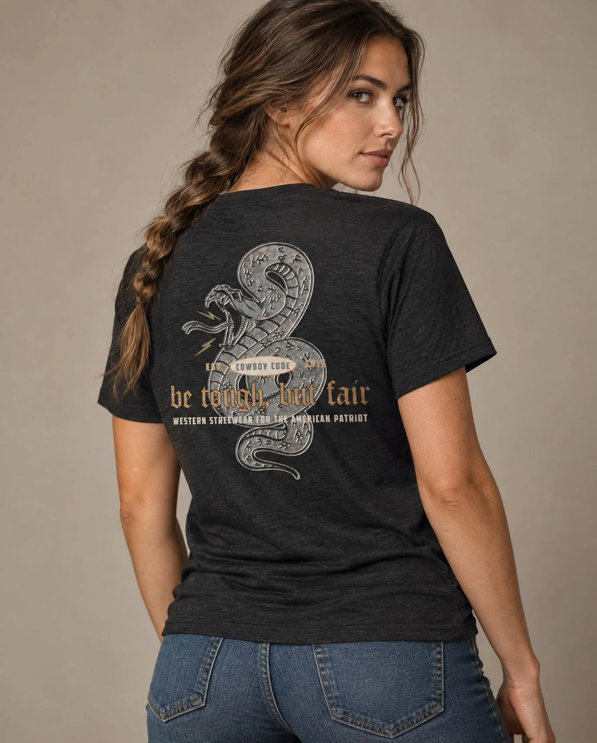 Female model in Cowboy Code No. 5 Be Tough, But Fair tee, Charcoal-Black, Cowboy Revolution