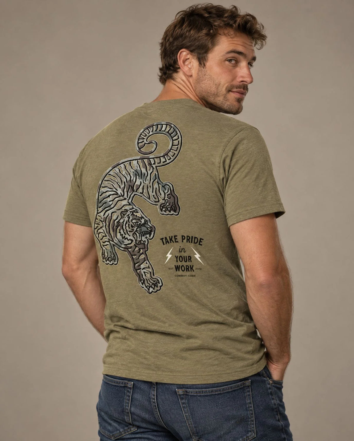 Male model in Cowboy Code No. 2 Take Pride in Your Work tee, Olive, Cowboy Revolution