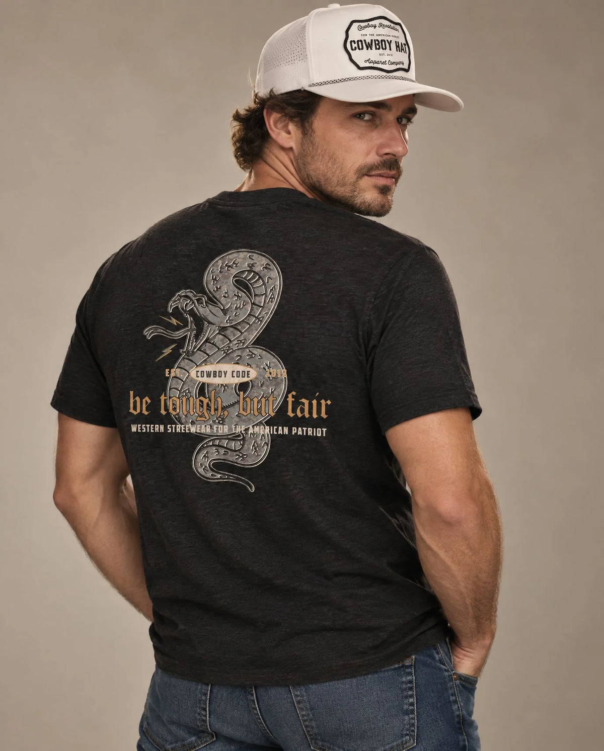 Male model in Cowboy Code No. 5 Be Tough, But Fair tee, Charcoal-Black and White rope hat, Cowboy Revolution